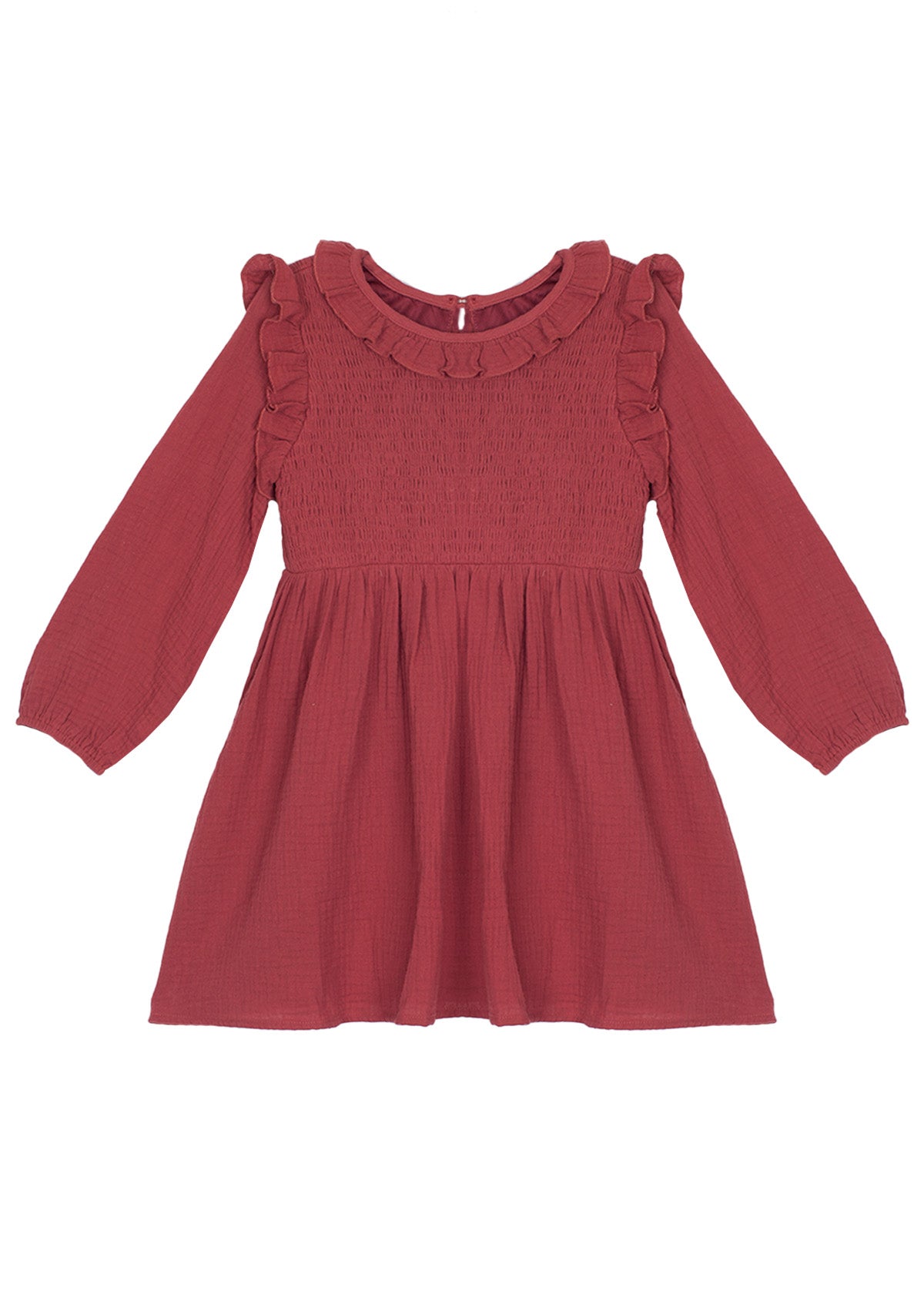 The Mabel and Honey Autumn Dress Red is a children’s knee-length, long-sleeve dress with shoulder ruffles and a smocked bodice, finished with a round neckline.
