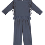 The Robyn Two Piece Set by Mabel and Honey features a navy peplum top with ruffled sides and hem, paired with matching wide-leg pants in a soft cotton blend, shown against a white background.