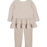 The Millie Two Piece Set by Mabel and Honey is a beige toddler outfit with a long-sleeve ruffle peplum top and matching leggings, displayed flat on a white background.