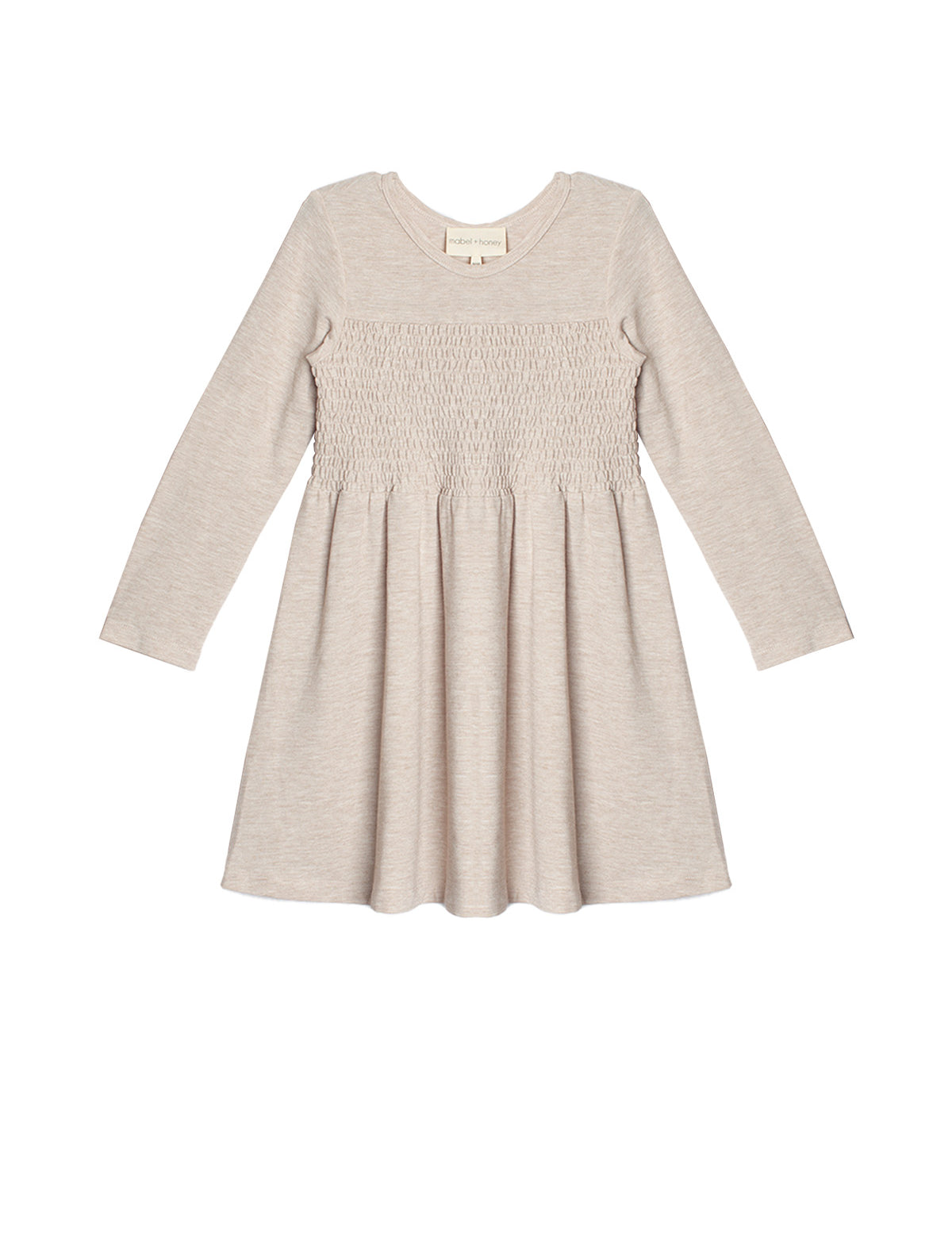 The Millie Natural Waist Dress by Mabel and Honey is a light beige, long-sleeved girl's dress with a smocked bodice and flared skirt, shown laid flat on a white background.