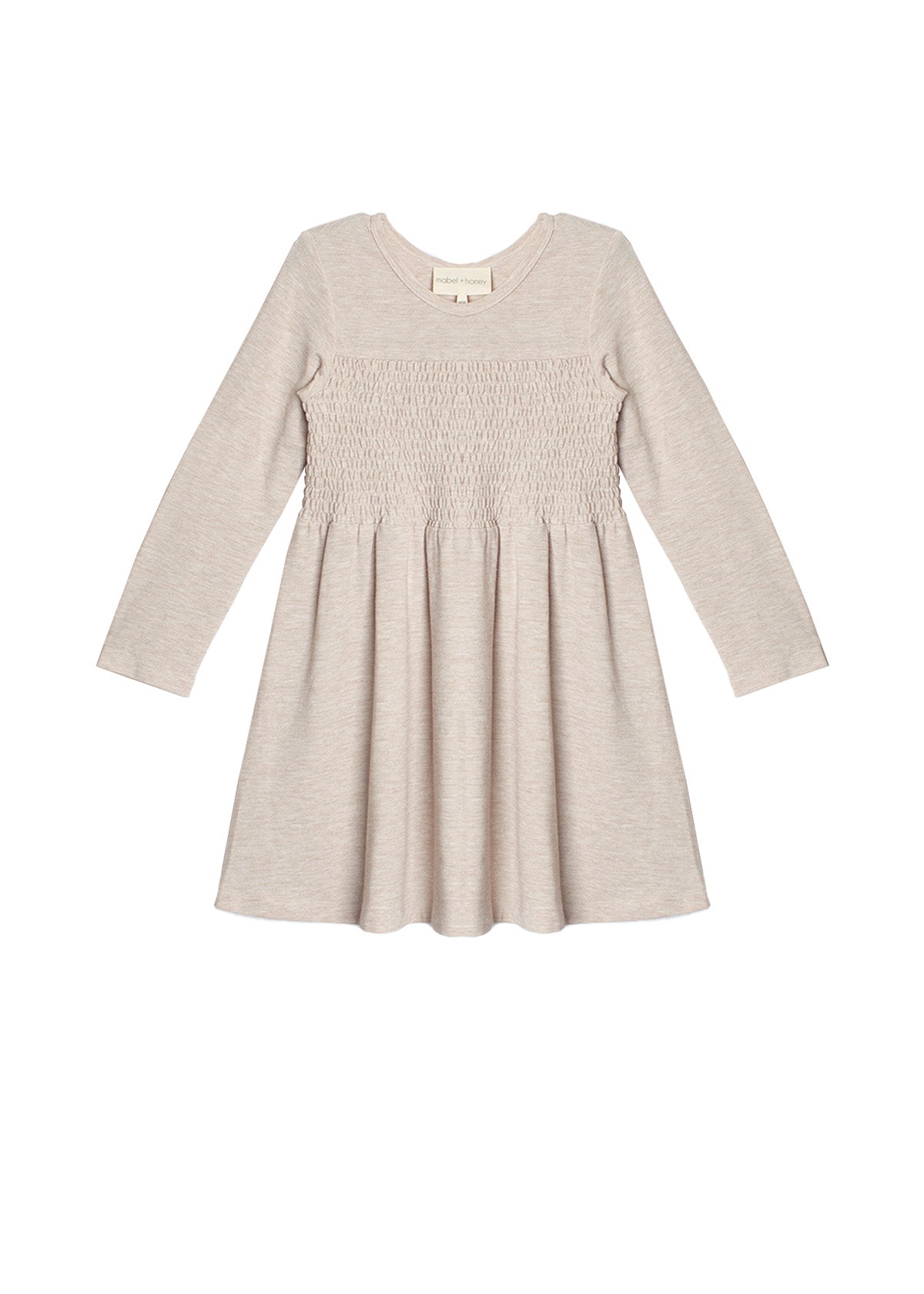 The Millie Natural Waist Dress by Mabel and Honey is a light beige, long-sleeved girl's dress with a smocked bodice and flared skirt, shown laid flat on a white background.