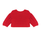 The Holly Jacket by Mabel and Honey is a bright red long-sleeve cropped top with textured fabric and gathered, slightly puffy sleeves, displayed laid flat on a white background.