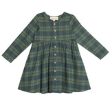 The Cozy Creatures Dress by Mabel and Honey is a children's knee-length, long-sleeve green plaid dress featuring front wooden buttons and a gathered waist.