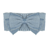 The Mabel and Honey Sunset Fields Hair Accessory with Bow features a large decorative bow and ruched elastic detail—perfect for adding flair to any look.
