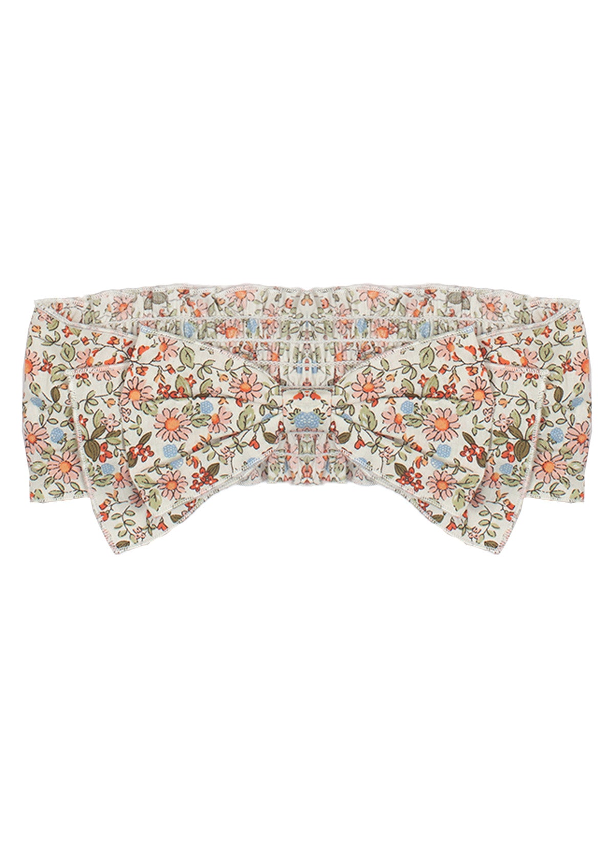 The Sunset Fields Hair Accessory by Mabel and Honey is a fabric headband with a large bow, showcasing a delicate botanical print in pink, orange, green, and blue on white.