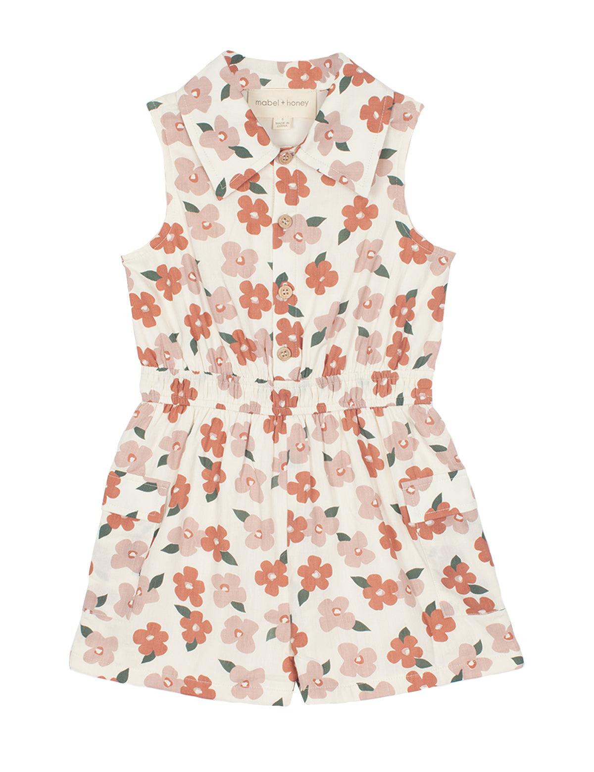 The Mavery Floral Romper by Mabel and Honey is a sleeveless, collared kids’ romper in a pink and red floral print with an elastic waistband and front buttons—perfect for sunny days.