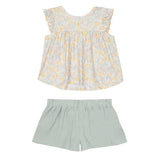 The Mila Two Piece Set by Mabel and Honey features a pastel-printed ruffle short-sleeve top in yellow and gray with solid sage green shorts, shown on a white background.