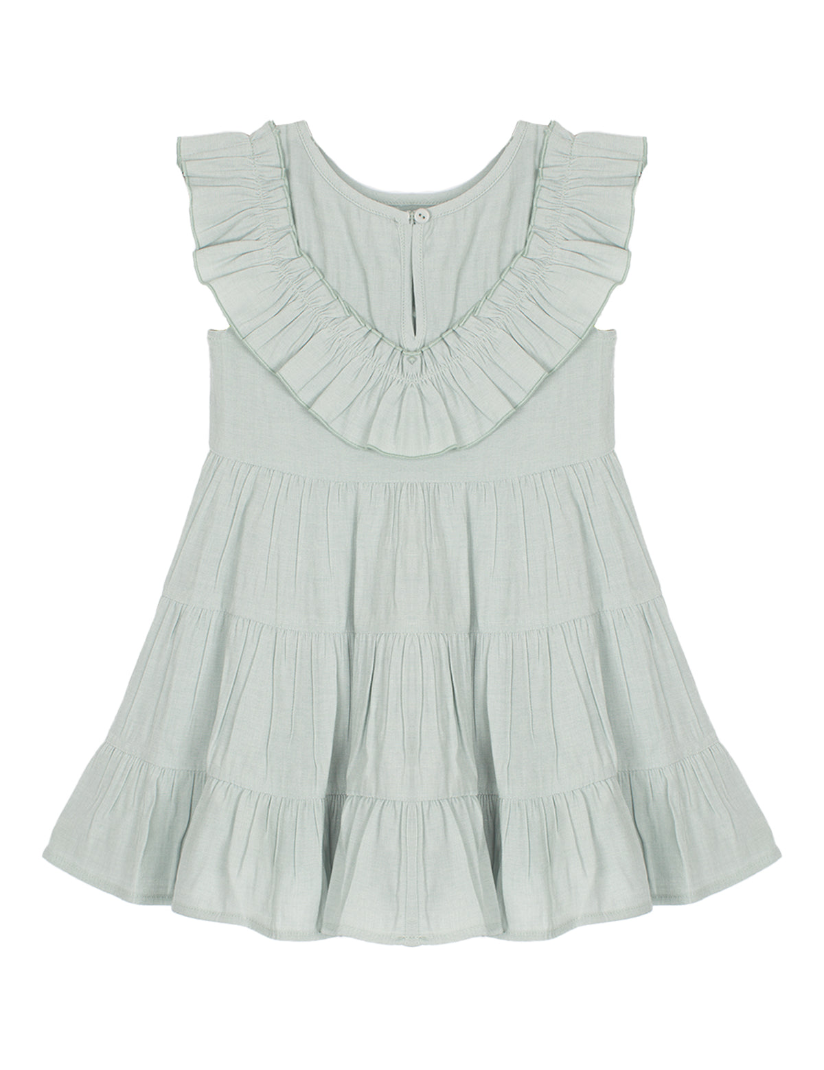 The Mila Green Emerald Dress by Mabel and Honey is a light sage green girl's dress with a sleeveless design, ruffled collar, tiered flared skirt, round neckline, and an easy back button closure.