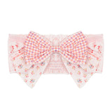 The Mabel and Honey Lacy Layered Hair Accessory features dusty rose fabric with a large bow, pink plaid center, and floral and striped patterns on the sides—perfect for girls.