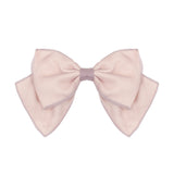 The Grace Pink Hair Accessory by Isobella and Chloe features a large light pink satin bow with wide loops, pointed tails, and a dusty rose center band—an elegant touch for any girl’s hairstyle.