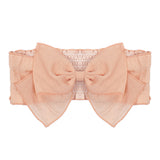 The Mabel and Honey Pitter Patter Hair Accessory is a dusty rose fabric belt with a large front bow and an elastic, ruched section at the back.