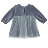 The Skylar Blue Suede Dress by Mabel and Honey features long sleeves, a round neckline, back button closure, and a sheer layered tulle skirt for an elegant touch.