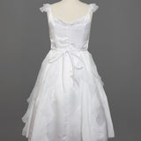 The Mabel and Honey Chiffon Ruffle and Satin Flower Girl Dress, shown on a mannequin with ruffled skirt layers, hand-beaded embellishment, and tied waist belt, is displayed against a plain gray background.