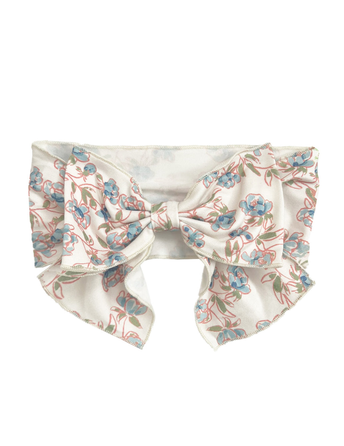 The Sadie Hair Accessory by Mabel and Honey is a wide white fabric headband with an oversized bow, decorated with a delicate blue and pink floral pattern and green stems.