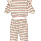 The Candy Stripe Two Piece Set by Mabel and Honey features pink and white stripes, a long-sleeve top with ruffled shoulders, and matching elastic-waist pants with cuffed ankles for a cozy look.