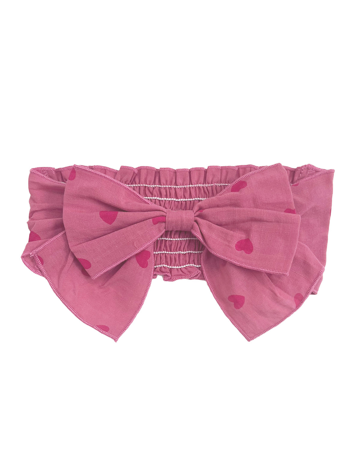 The Perfect in Pink Hair Clip Accessory by Mabel and Honey features an elastic, ruched band and a statement bow with a charming red heart pattern.