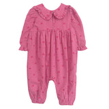 The Perfect in Pink Romper by Mabel and Honey is an adorable pink baby girl outfit featuring long sleeves, a ruffled collar, heart pattern, and gathered details at the waist, wrists, and ankles for a sweet, comfy fit.