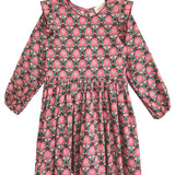 The Perfect in Pink Dress by Mabel and Honey features long sleeves, pink floral print, ruffled shoulders, and a gathered waist—knee-length and ideal for any occasion.