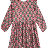 The Perfect in Pink Dress by Mabel and Honey is a charming, feminine long sleeve dress with pink floral print, ruffle details, knee-length cut, gathered waist, and elastic cuffs.