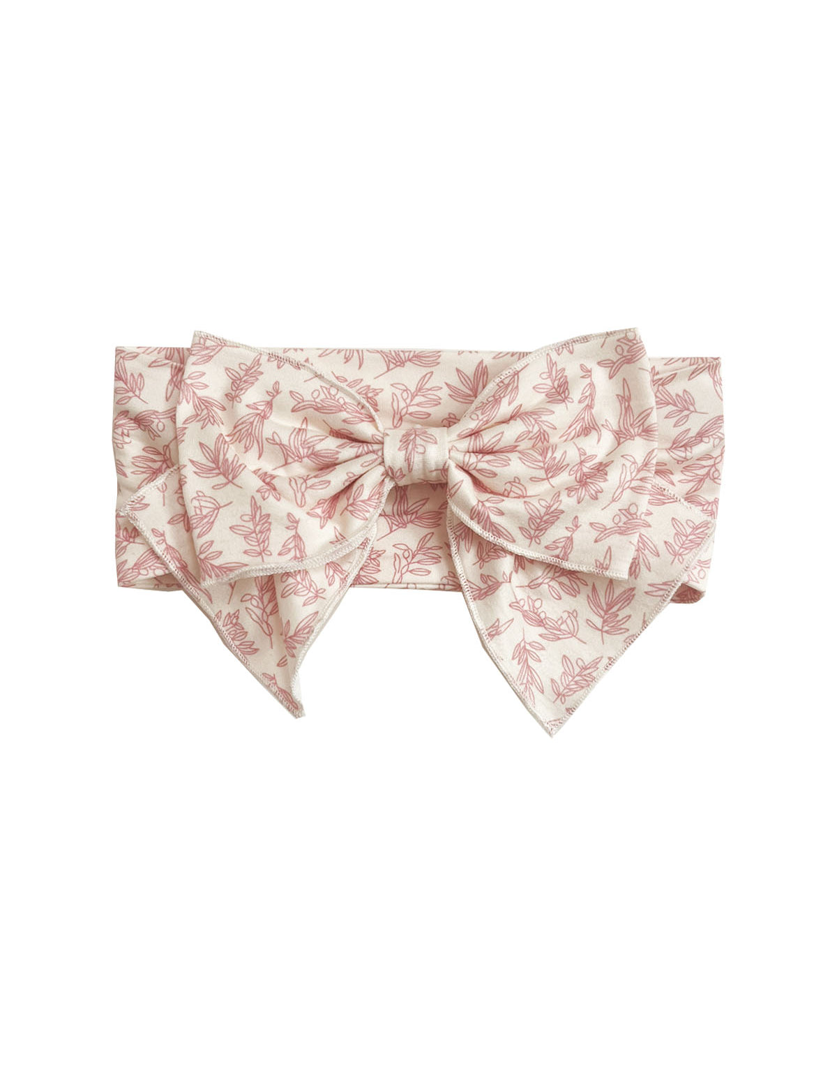The Primrose Hair Accessory by Mabel and Honey features a wide, light pink fabric with a delicate floral print and a large, structured pink botanical bow at the front.