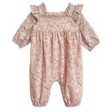The Mabel and Honey Paisely Romper features long sleeves, ruffled shoulders, and a pink paisley print with gathered fabric at the chest and ankles for a loose, comfy fit—perfect for your little one.