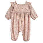 The Mabel and Honey Paisely Romper features long sleeves, a pink and beige floral paisley print, ruffled shoulders, gathered cuffs at wrists and ankles, and a square neckline—perfect for your stylish little one.