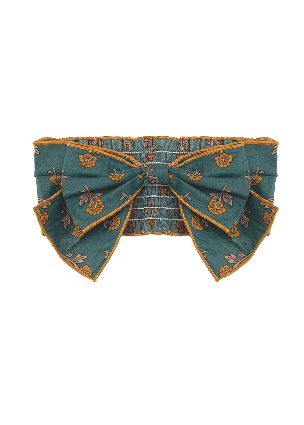 A teal belt with yellow floral patterns, an oversized center bow, and gold-trimmed edges pairs perfectly with the Mabel and Honey Autumn Ivy Hair Accessory.