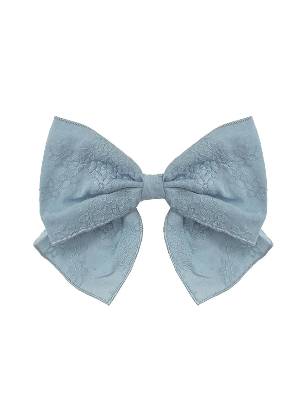 The Mabel and Honey Eva Hair Accessory is a large, light blue bow with a subtle floral pattern and gently curved ribbon tails, shown on a white background.