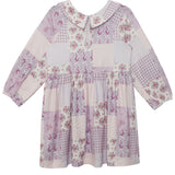 The Liliana Floral Dress by Mabel and Honey is a long-sleeved, knee-length children’s dress with a Peter Pan collar, pink and purple floral and gingham prints, and a button at the neckline for a charming finish.