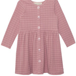The Liliana Plaid Dress by Mabel and Honey is a childrens long-sleeve, dusty pink plaid dress with a round neckline, front button closure, gathered waist, and an A-line skirt.
