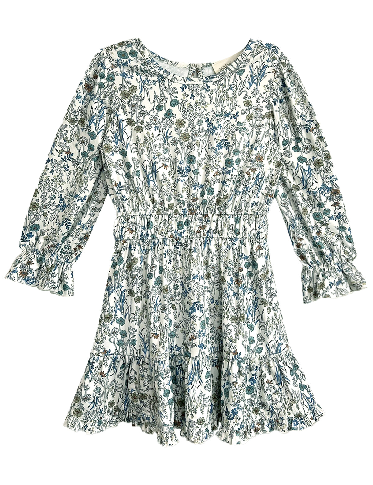 The Brooklyn Floral Dress by Mabel and Honey is a long-sleeve white dress with a green and blue floral pattern, cinched waist, ruffled cuffs, and ruffled hem.