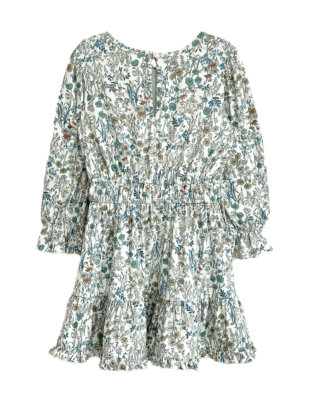 The Brooklyn Floral Dress by Mabel and Honey is a girls' knee-length dress in green, blue, and brown floral on white with long sleeves, a gathered waist, ruffled hem, and button-back closure.