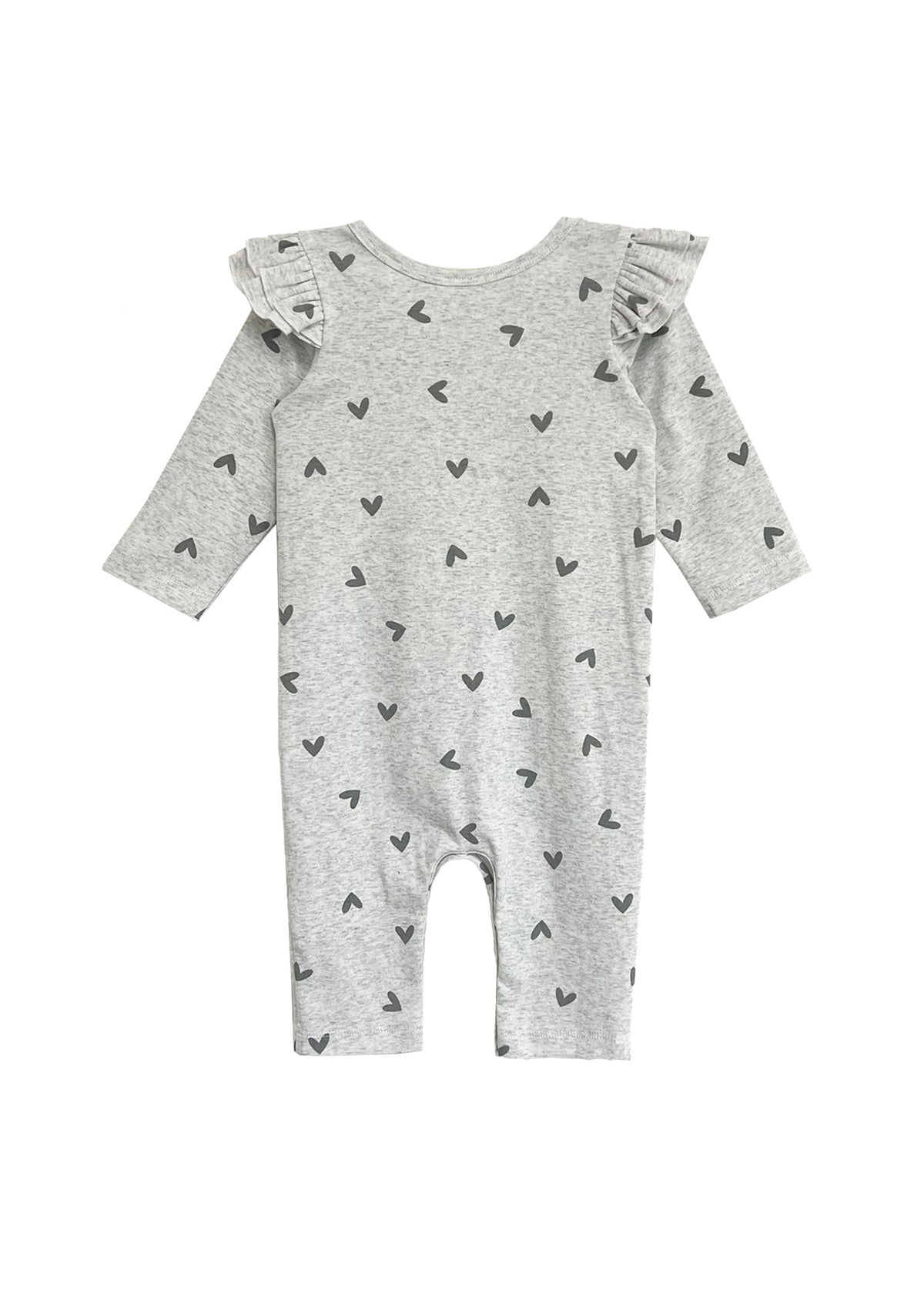 The Heartfelt Romper by Mabel and Honey is a long-sleeved, light gray romper with black heart patterns and ruffled shoulders, shown laid flat on a white background.