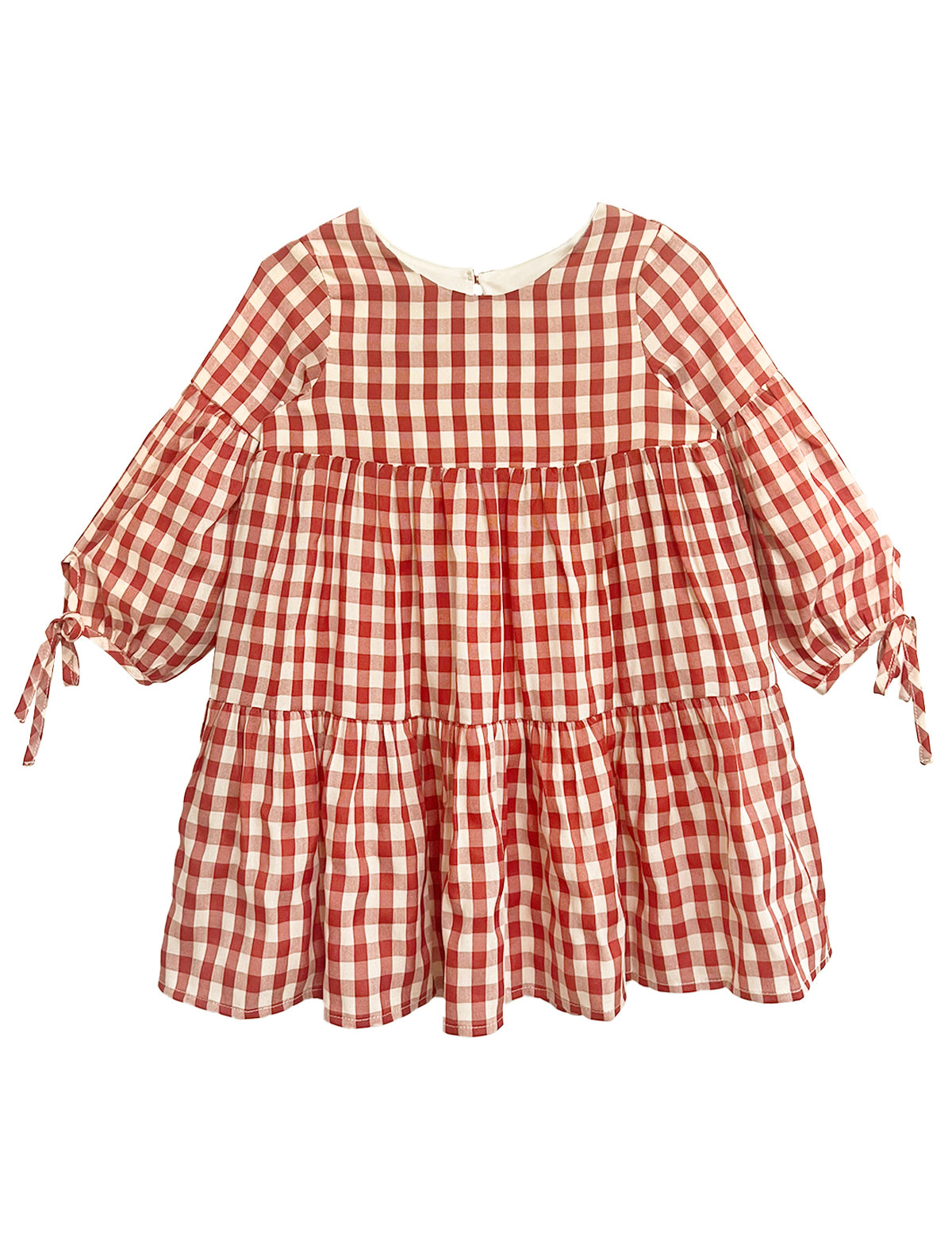 The Tis' the Season Dress by Mabel and Honey is a loose-fitting, long sleeve red and white gingham dress with tiered ruffles and cuff bow ties—ideal as a holiday dress for girls.