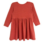 The Mabel and Honey Tea Party Red Gingham Dress is a long-sleeve, knee-length girls dress with a gathered waist and flared skirt, perfect for everyday elegance or as a charming tea party outfit, shown on a white background.