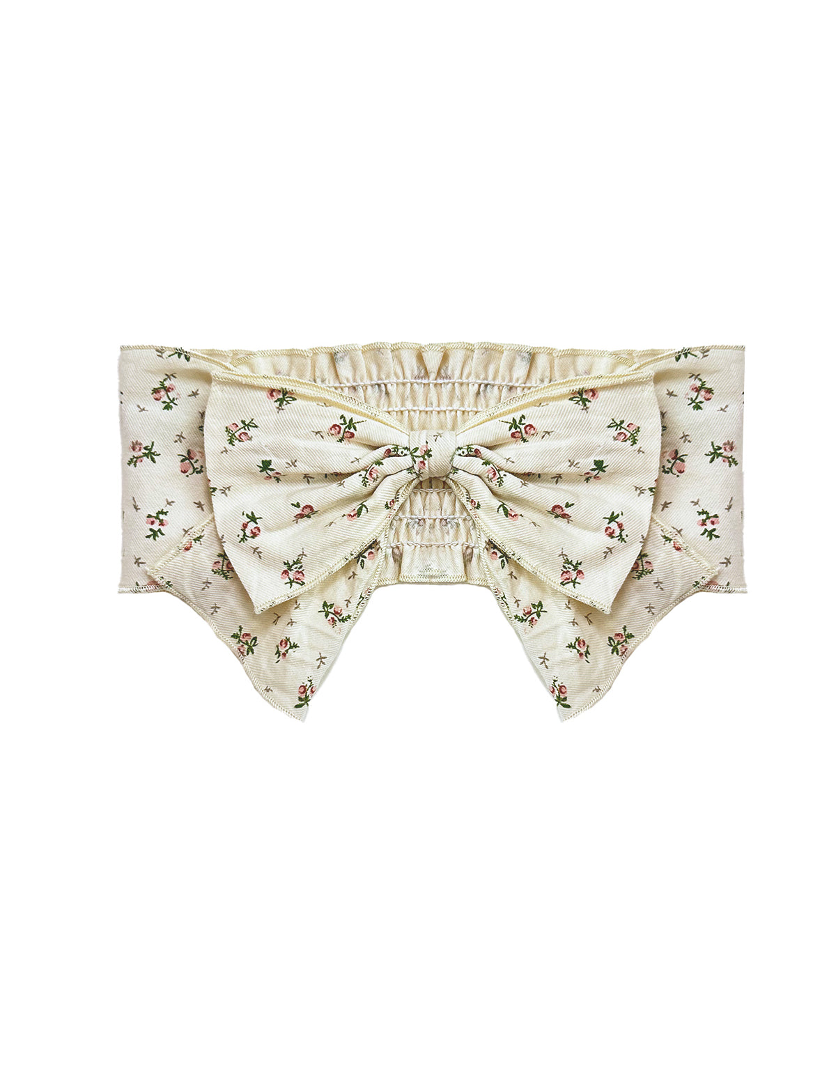 The Juliette Hair Accessory by Mabel and Honey features a cream base with a pink floral print, a large pink flower bow at the center, pointed edges, and an elastic ruched band for comfort.