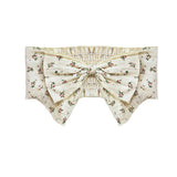 The Juliette Hair Accessory by Mabel and Honey features a cream base with a pink floral print, a large pink flower bow at the center, pointed edges, and an elastic ruched band for comfort.