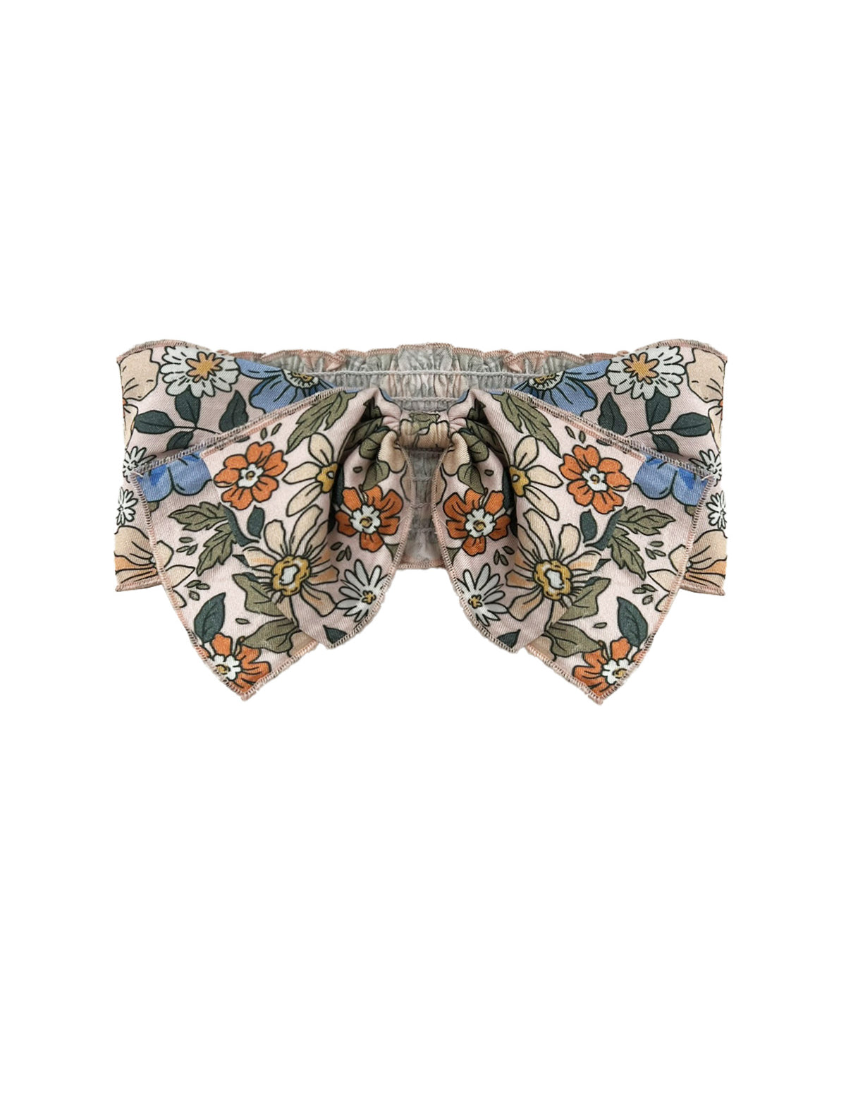 The Riley Hair Accessory by Mabel and Honey is a baby girl bow with orange, blue, and white flowers plus green leaves on beige. It features a gathered center and pointed ends for added charm.