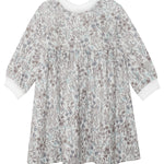 The Meadow Dress by Mabel and Honey is a girls’ long-sleeved floral dress with a white background, blue and grey print, gathered waist, and white cuffs—ideal for comfortable everyday wear.