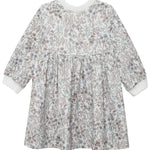 The Meadow Dress by Mabel and Honey is a girls' knee-length, long-sleeve floral dress in brown and blue on white, with a gathered waist, round neckline, and white cuffs—ideal for comfortable everyday wear.