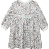 The Meadow Dress by Mabel and Honey is a girls' knee-length, long-sleeve floral dress in brown and blue on white, with a gathered waist, round neckline, and white cuffs—ideal for comfortable everyday wear.