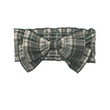 The Plaid & Pine Hair Accessory by Mabel and Honey is a green and white plaid headband with a large center bow and stitched edge detail—an adorable, handcrafted baby hair accessory.