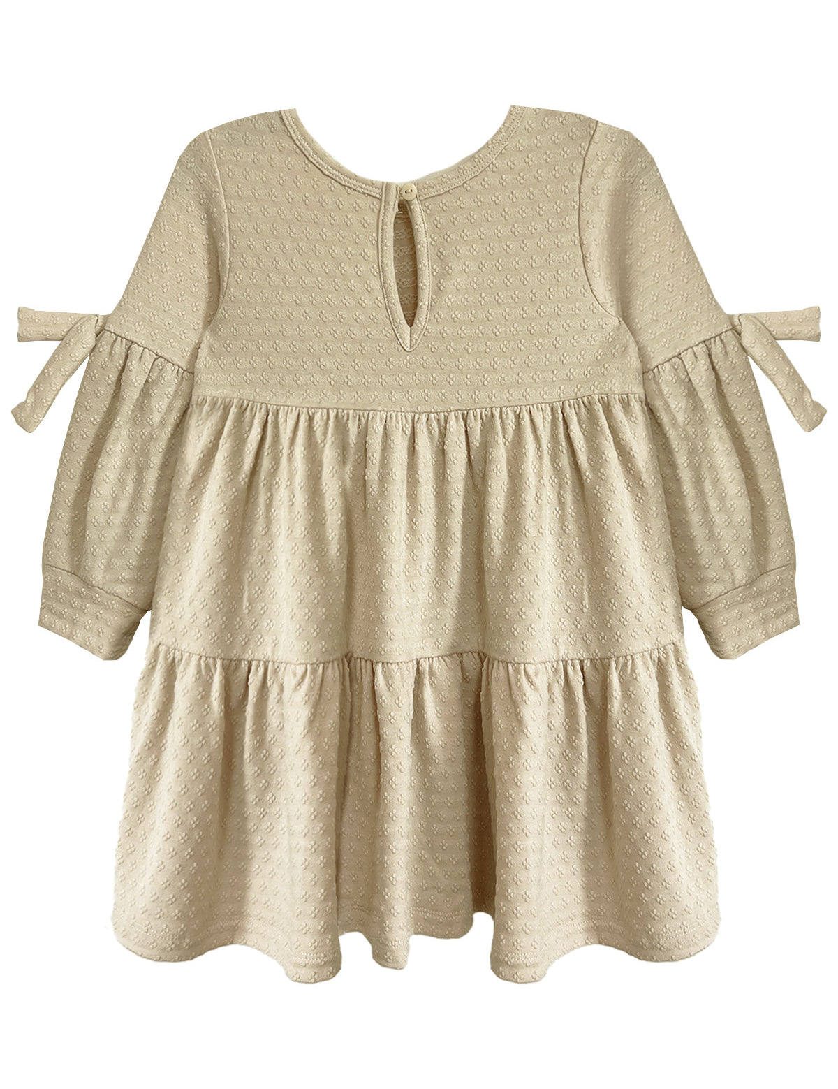 The Cinnamon Sugar Dress by Mabel and Honey features a cream, long-sleeve tiered design with textured dot fabric, ruffled skirt, small bow ties on the arms, and a keyhole button closure at the back for easy dressing.