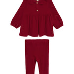 The Rosie Two Piece Set by Mabel and Honey features a deep red, long-sleeved top with a ruffled collar and front button, paired with matching ribbed leggings. Both pieces are displayed on a white background.