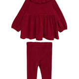 The Mabel and Honey Rosie Two Piece Set features a red long-sleeve, ruffled-collar top with flared hem and matching ribbed leggings, both made from cozy ribbed fabric and shown against a white background.