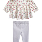 The Mia Two Piece Set by Mabel and Honey includes a floral blouse with a ruffled collar and long sleeves, paired with light purple leggings—an adorable outfit for girls.