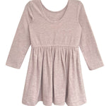 The Heather Dress by Mabel and Honey is a ribbed pink long sleeve dress for children, featuring a round neckline, gathered skirt, and soft textured fabric for comfort.
