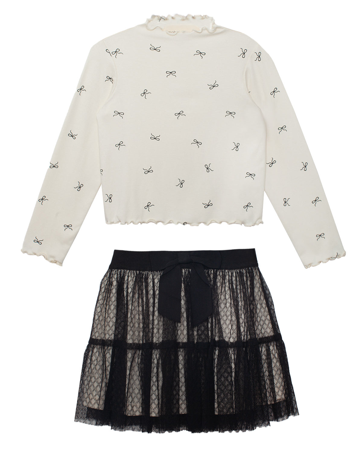 The Bow Chic Two Piece Set by Mabel and Honey features a cream long-sleeve top with black bow print and ruffled edges, paired with a layered black lace skirt topped with a cute bow at the waistband.