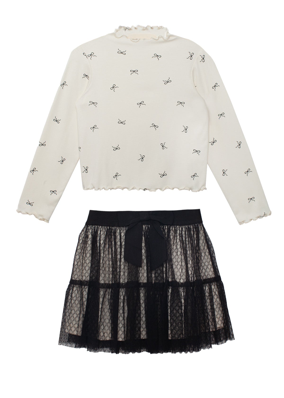 The Bow Chic Two Piece Set by Mabel and Honey features a cream long-sleeve top with black bow print and ruffled edges, paired with a layered black lace skirt topped with a cute bow at the waistband.