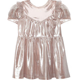 The Isobella and Chloe Golden Glow Pink Dress is a metallic pink children’s dress with puffed short sleeves, ruffled shoulder details, and an A-line silhouette.
